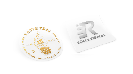 A round sticker and a square sticker arranged side-by-side, stamped with gold and silver foil respectively.
