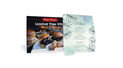 Two tent cards are placed side-by-side, one promoting a promotion, another featuring a menu.