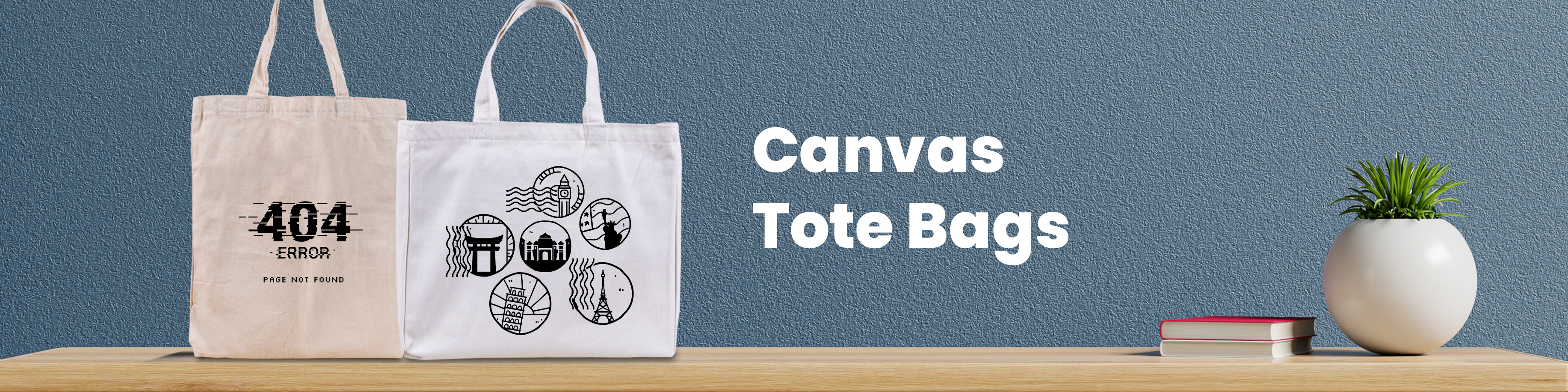 Two tote bags stand next to each other on a wooden surface against a blue background. One is tall and made of raw canvas, another is wide and of white canvas. Both have designs printed in black. There is a small potted plant and two small books nearby.