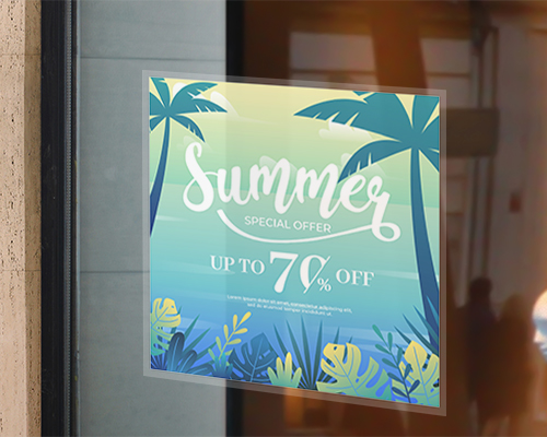 A gradient colour static cling window sticker is placed on the window, printed with a design stating 'Summer Special Offer', Up to 70% Off with illustrations of coconut trees and leaves.
