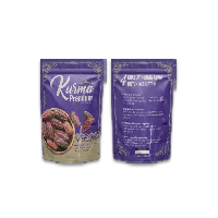 A purple standing pouch packaging advertises premium kurma.