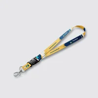A lanyard with buckle and geometric design in green, yellow and white,