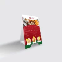 A tent card with the restaurant menu in red, green, yellow and white.