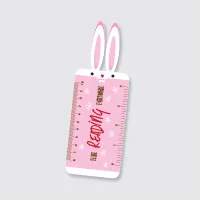 A die-cut shape magnet with rabbit and ruler design