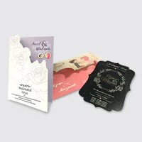 Three wedding cards with various shape in purple, pink and black respectively.