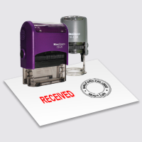 A self-inking stamp chop with various design lay on a white background is provided in Excard