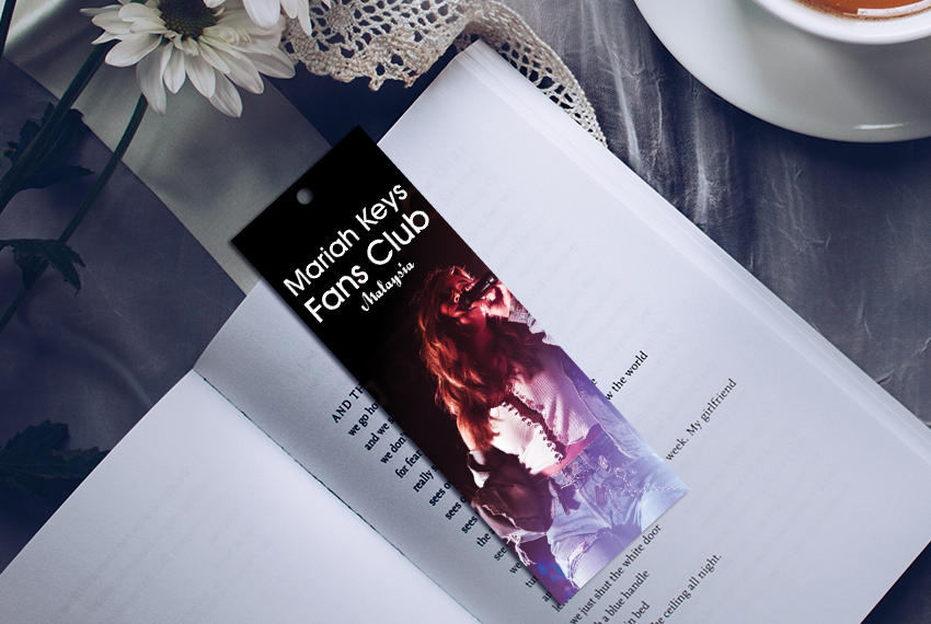A bookmark with a hole punched out of the top featuring an image of a singer, and labelled “Fan Club”.