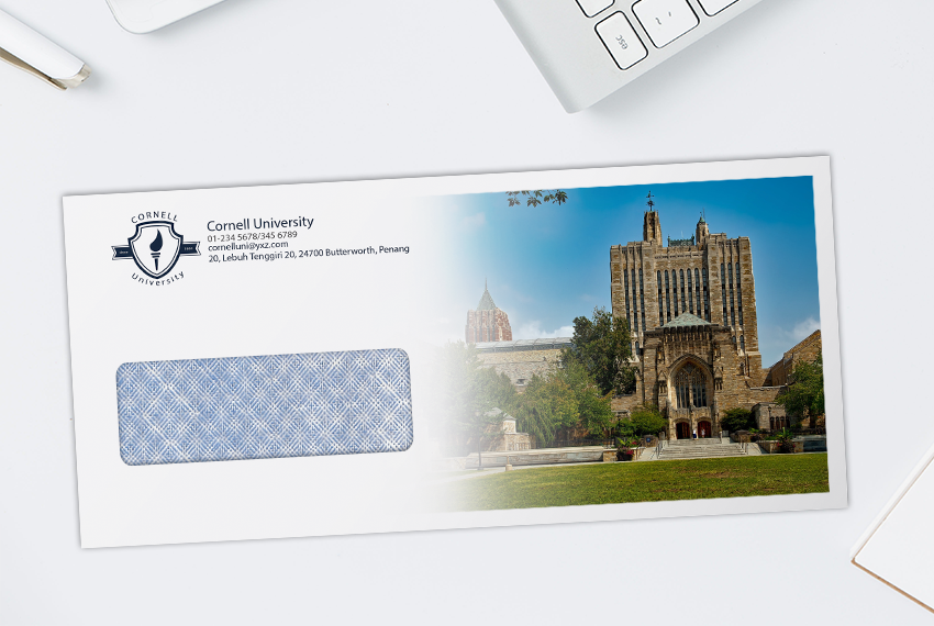 A simple envelope for a university printed with a photograph of a university building.