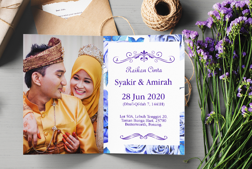 A card featuring an image of a couple printed as an invitation to their wedding.