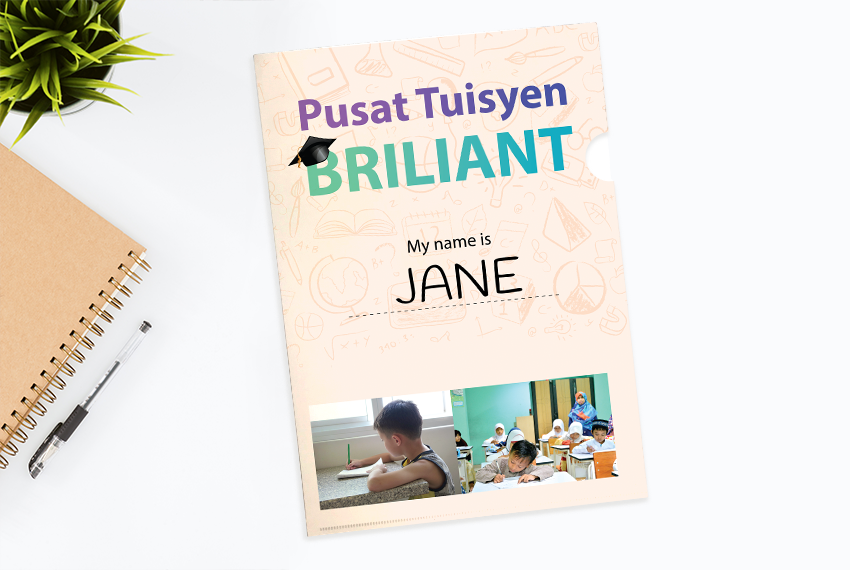 A plastic folder with the words “Pusat Tuisyen Briliant” on the cover, and photographs of children studying at the bottom.