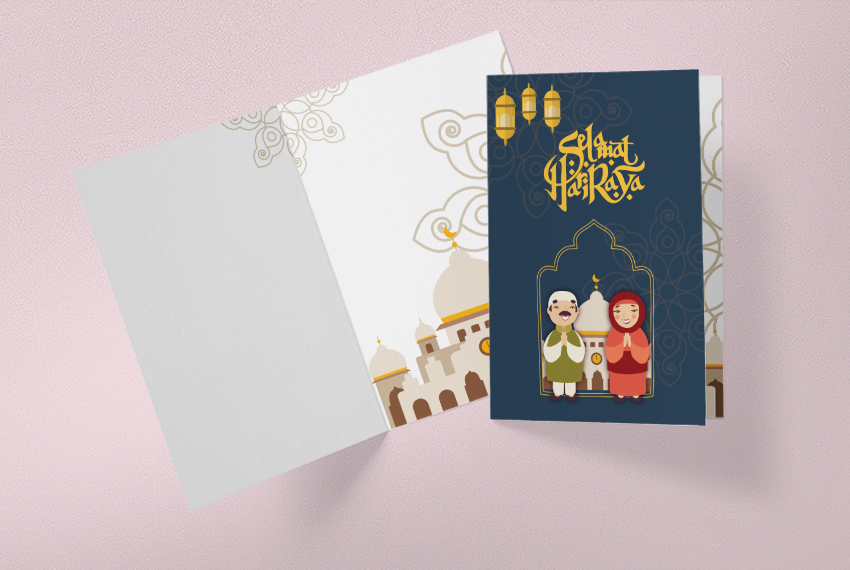 A greeting card featuring a cartoon couple in front of a white mosque with the words “Selamat Hari Raya” printed over the top. The inside of the card features a white mosque.