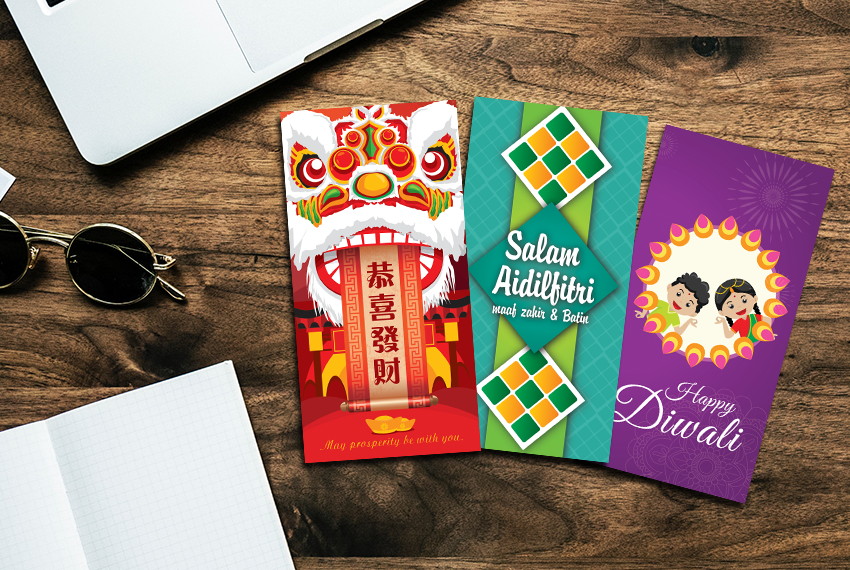 A series of three money packet designs, one for Chinese New Year, one for Hari Raya Aidilfitri, and one for Diwali, arranged neatly on a wooden background.