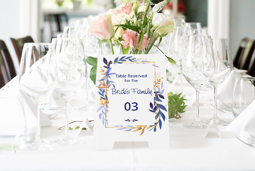 A tent card being used as a table number at a banquet.