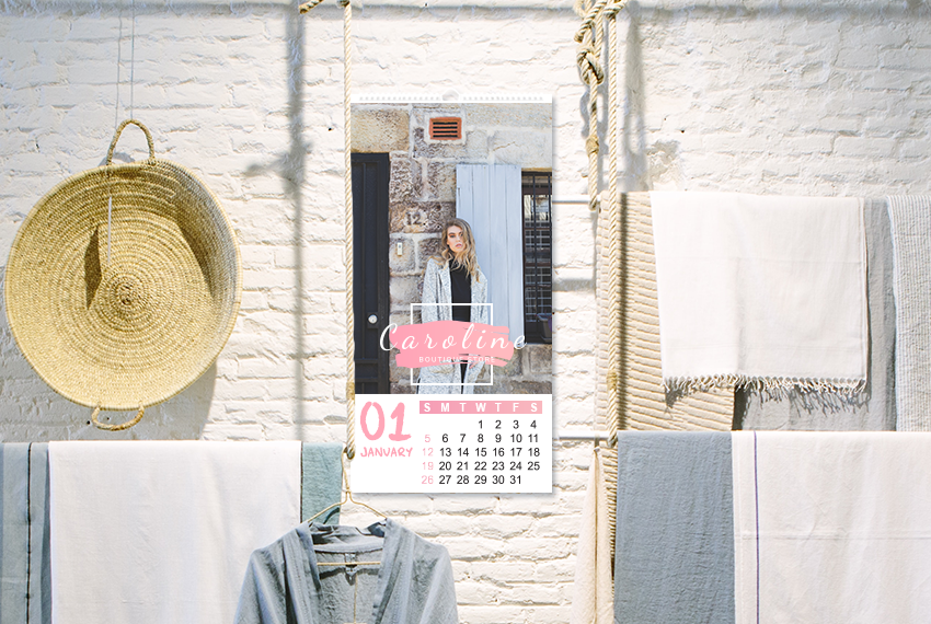 A simple wire-O bound wall calendar featuring an image of a woman placed on a brick wall painted white.